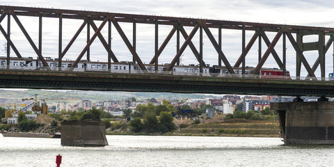Train moving on bridge over the Danube River, Serbia