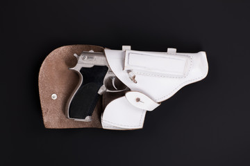 white holster with a gun