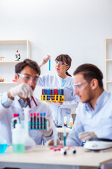 Team of chemists working in the lab