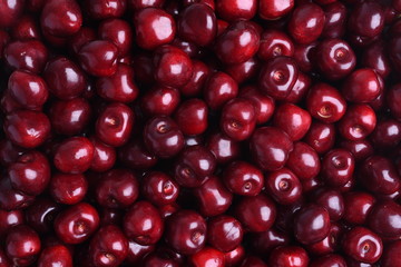 Fresh sweet cherry fruit on the market as background 