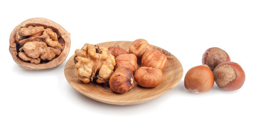 Walnuts and hazelnuts isolated on white