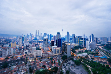 Naklejka na ściany i meble Beautiful cityscape with cloudy sky and skyscrapers. Megapolis Kuala-Lumpur, Malaysia. 24th of November 2015.