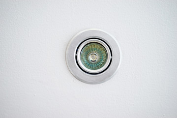 Small lamp spot on white ceiling.