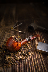smoking pipe with tobacco leaves