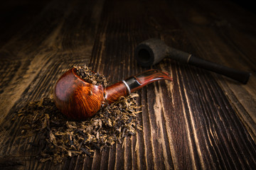 smoking pipe with tobacco leaves