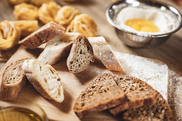 preparation recipe bread, pizza, spaghetti making ingridients, food flat lay on kitchen table background.