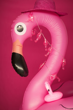 pink inflatable flamingo on pink, can be used as background.