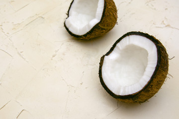 broken coconut on a white beige texture