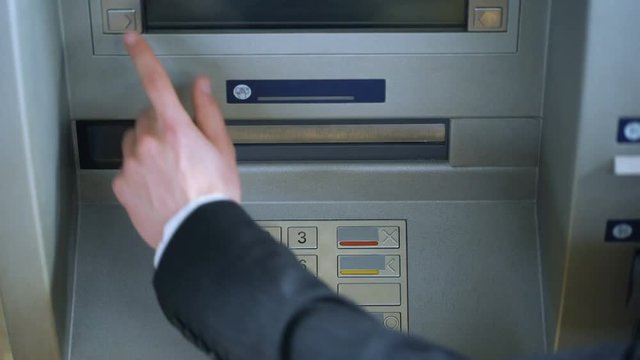 Customer completing bank transaction, withdrawing Russian rubles money cash