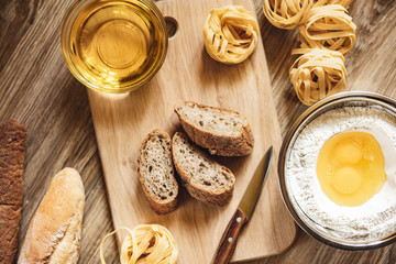 preparation recipe bread, pizza, spaghetti making ingridients, food flat lay on kitchen table...