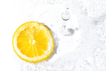 fresh lemon slice and water splash