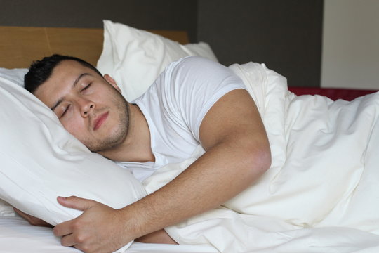 Ethnic male sleeping in comfortable position 