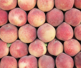 Close-up of fresh peaches. Fruit background (selective focus)