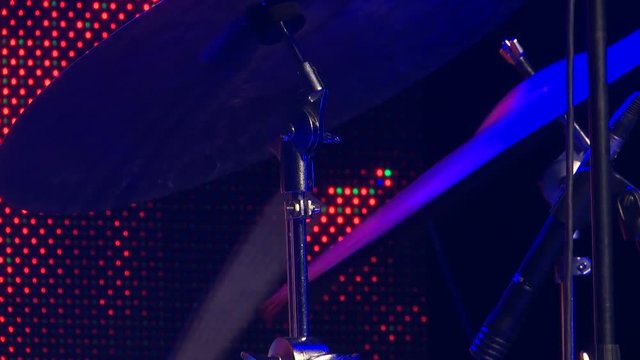 Cymbals on Stage during a Show with really cool lighting close up shot