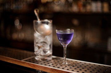 Elegant glass filled with fresh and strong summer cocktail