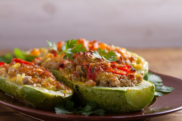 Zucchini stuffed with meat, vegetables and cheese. Zucchini boats