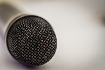 Microphone, selective focus, on a light background, close up