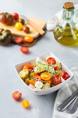 Organic tomato salad with mozzarella cheese and toasted bread