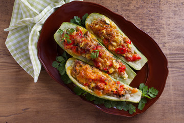 Zucchini stuffed with meat, vegetables and cheese. Zucchini boats. View from above, top studio shot