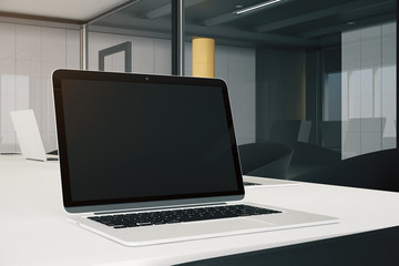 Closeup of desktop with empty laptop