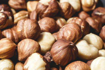 Pile of hazelnuts close-up as background