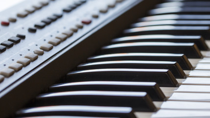 Keyboard synthesizer, close-up of white and black keys