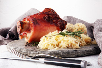 Roasted pork knuckle. Ham and bacon are popular foods in the west. German Schweinshaxe or Haxe