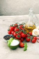 Ripe tasty red tomatoes with salt and basil. Village market organic tomatoes and garlic. Fresh tomato