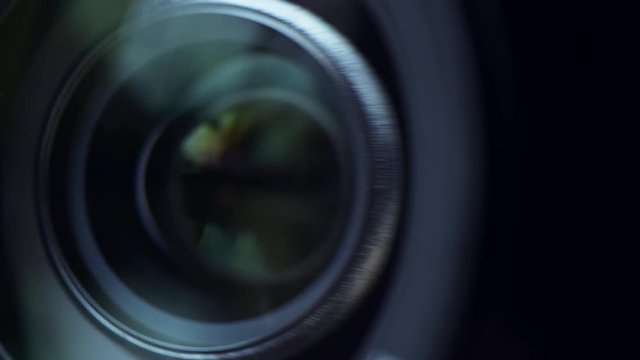 Security camera lens zooming in, close up. Private property protection and public surveillance concept.