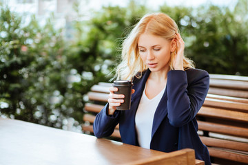 Beautiful woman drinking coffee in a cafe