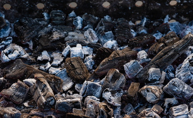 Photo of hot sparking live-coals burning in a barbecue.