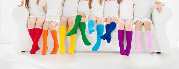 Kids with colorful socks. Children footwear.