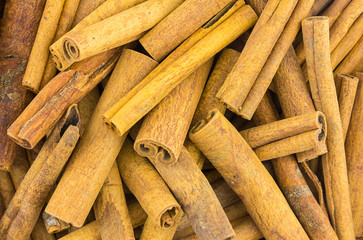 stick cinnamon pile of dry fragrant spices background culinary base