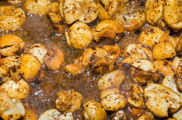 small champignons in marinade and spices pepper salt fried quick appetizer