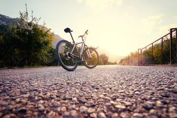 Crédence de cuisine en verre imprimé Vélo Healthy lifestyle. Close up of mountain bicycle on the road against sunny sky.