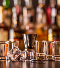 Traditional pure vodka in glasses on a black background, chilled drink