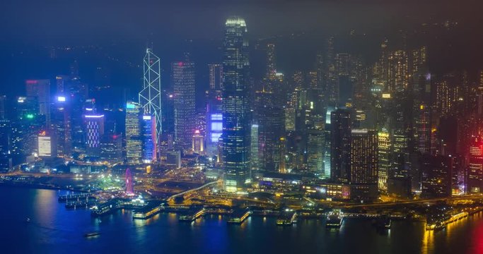 Aerial timelapse of illuminated Hong Kong skyline. Hong Kong, China