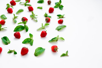 Strawberries and fresh mint on white background, copy space