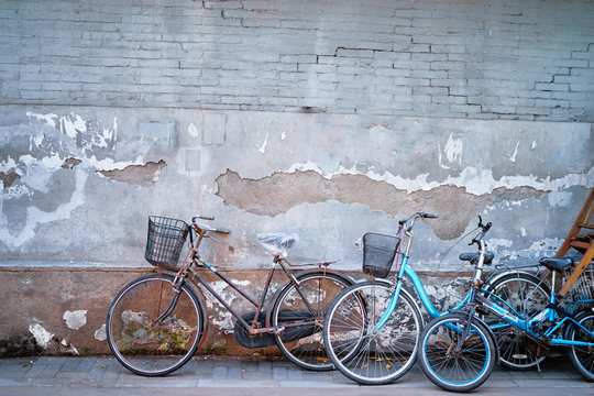 Retro bicycles against brick wall.