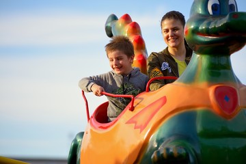 Mother and son ride on the Russian roller coaster