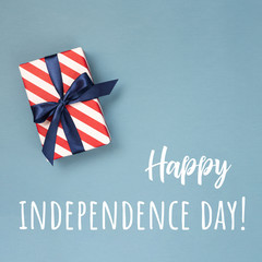 Happy Independence Day card with gift box in national colors and text. Conceptual idea.