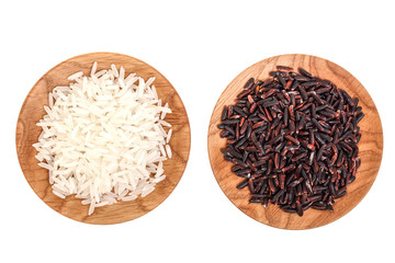 white and black rice grains in wooden bowl isolated on white background. Top view. Flat lay