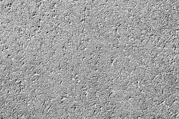 White and gray grungy textured concrete wall. Dirty painted stone background, city building wallpaper with place for text