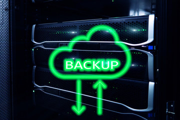 Backup button on modern server room background. Data loss prevention. System recovery.