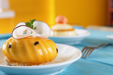 Plate with tasty cake on table, closeup