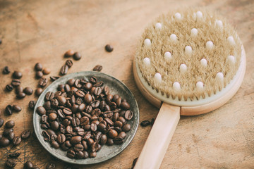 Anticellulite brush with a coffee on an old background