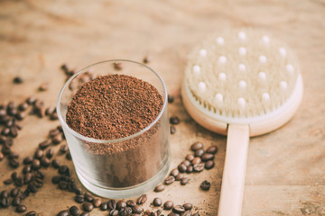 Anticellulite brush with a coffee on an old background