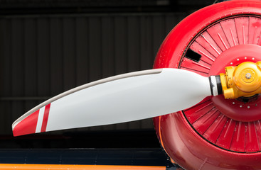 Airplane, red cowling and white prop