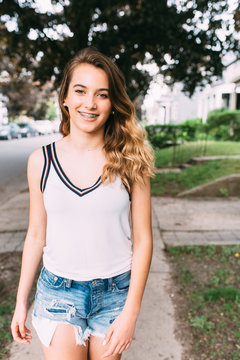 A young teenager in the city in the summer