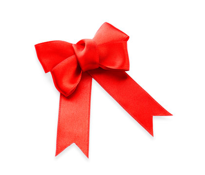 Red ribbon bow on white background, top view